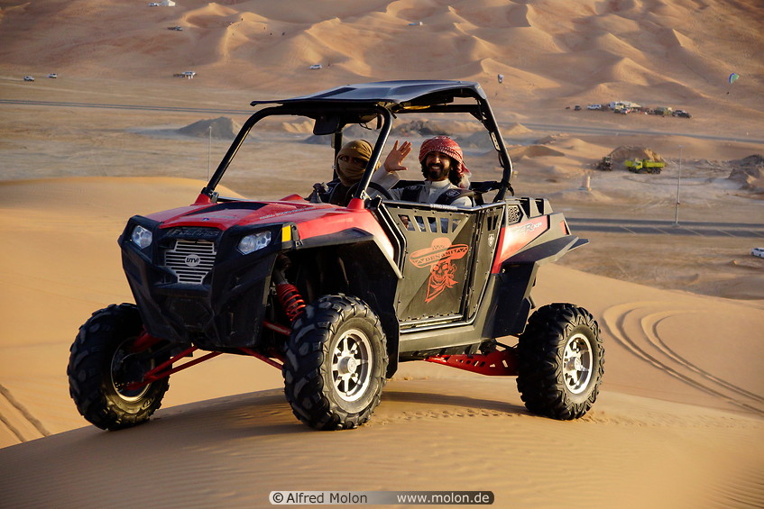 25 Sandrail driving on sand dune