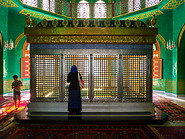05 Woman praying at tomb