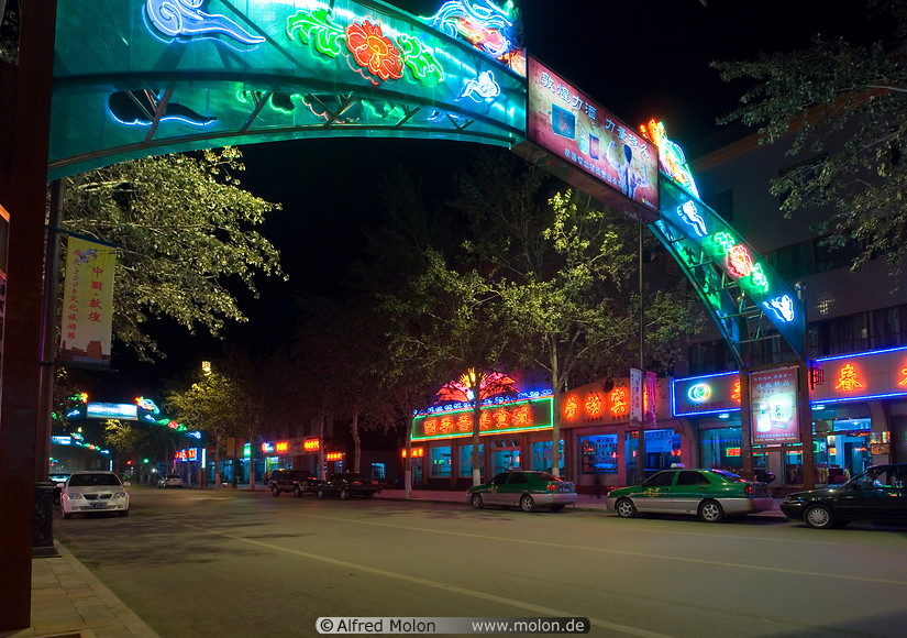 25 Street at night with neon lights and decorations