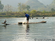 07 Fishermen with cormorant on bamboo boat