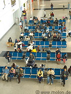 04 Travellers sitting in waiting area