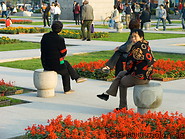 09 People sitting on stone chairs