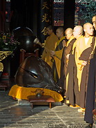 08 Buddhist monks praying in the temple