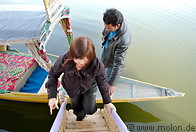 03 Female Malaysian Chinese tourist entering houseboat