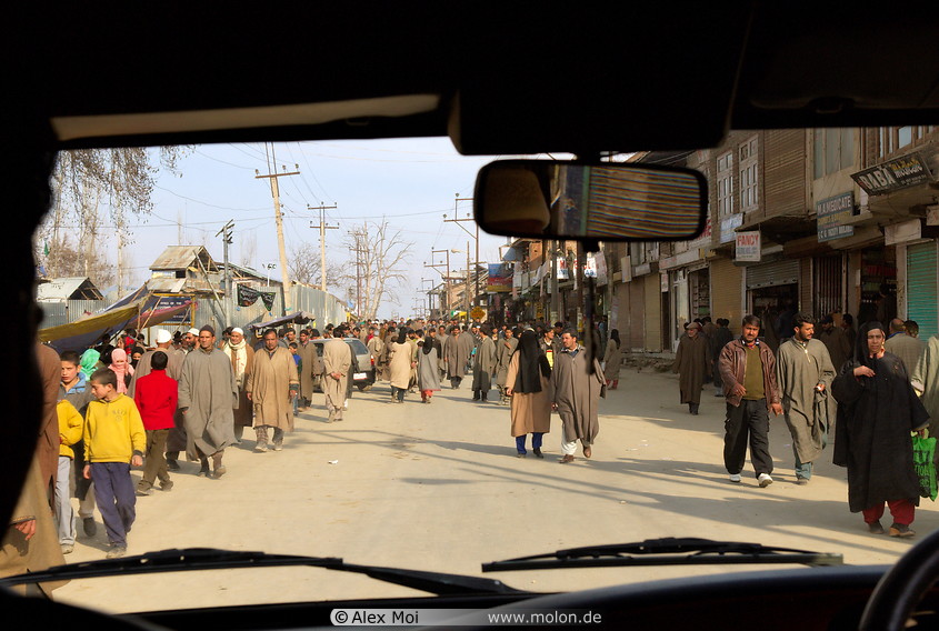 13 Kashmiri people walking along street