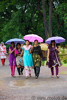 08 Young Indian women with umbrellas in Thripunithura hill palace