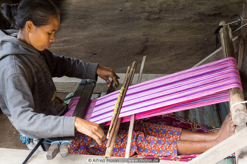 13 Woman weaving cloth