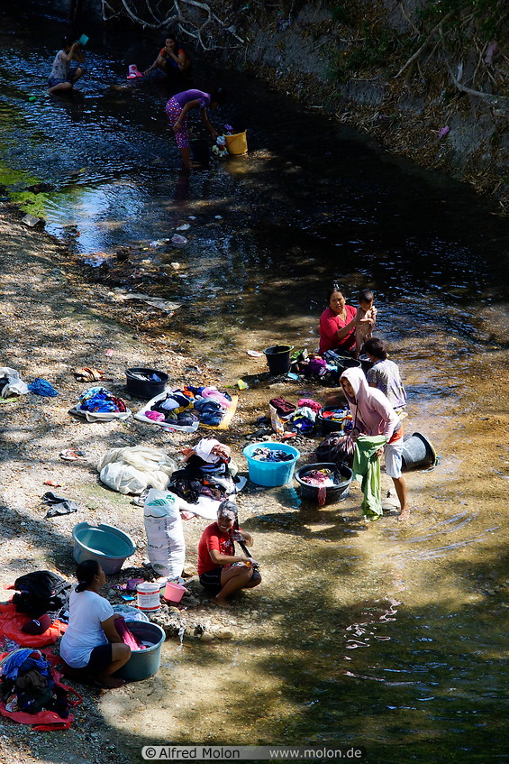 11 Women washing clothes in the river