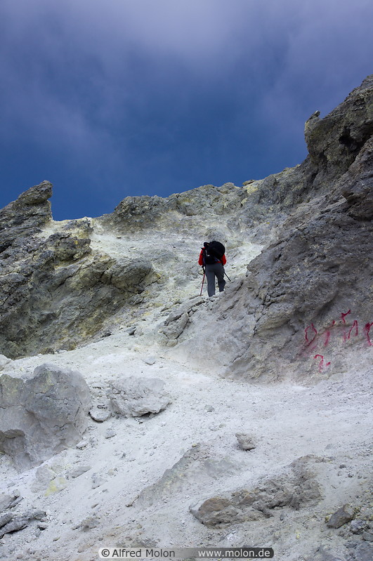 34 Hiker among summit crater rocks