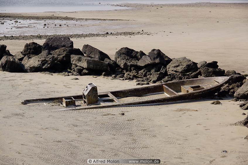 15 Old boat buried under the sand