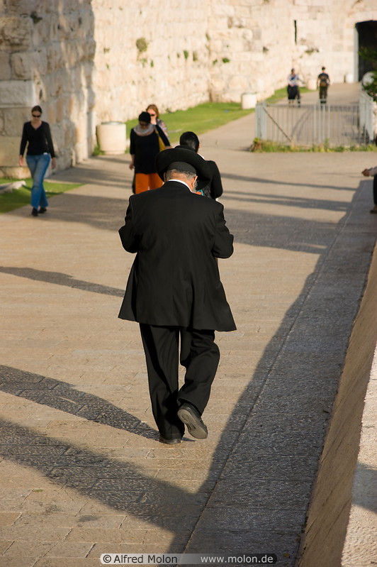 03 Orthodox jew walking along city wall