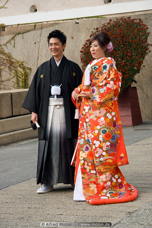 Photo of Japanese couple wearing kimonos. Osaka castle, Osaka, Japan