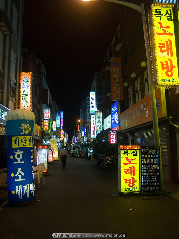10 Alley with shops and neon lights