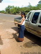 10 Lao woman refuelling