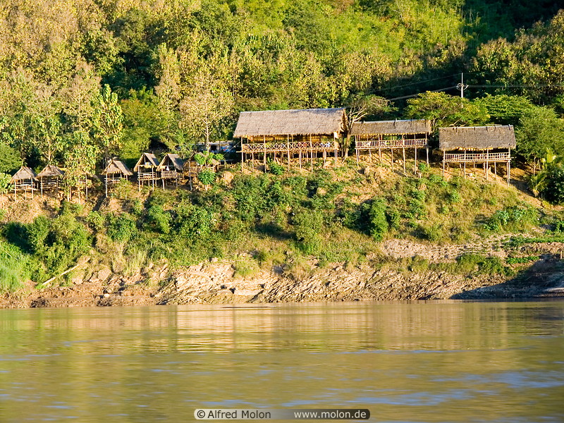 17 Houses on stilts along riverbank