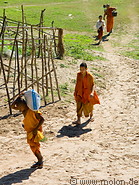 11 Buddhist monk carrying bags
