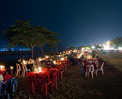 14 Restaurant tables along Mekong river at night