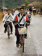 20 Schoolchildren riding bicycles back home