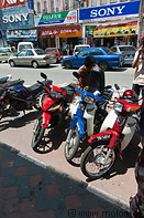 18 Motorbikes parked on pavement