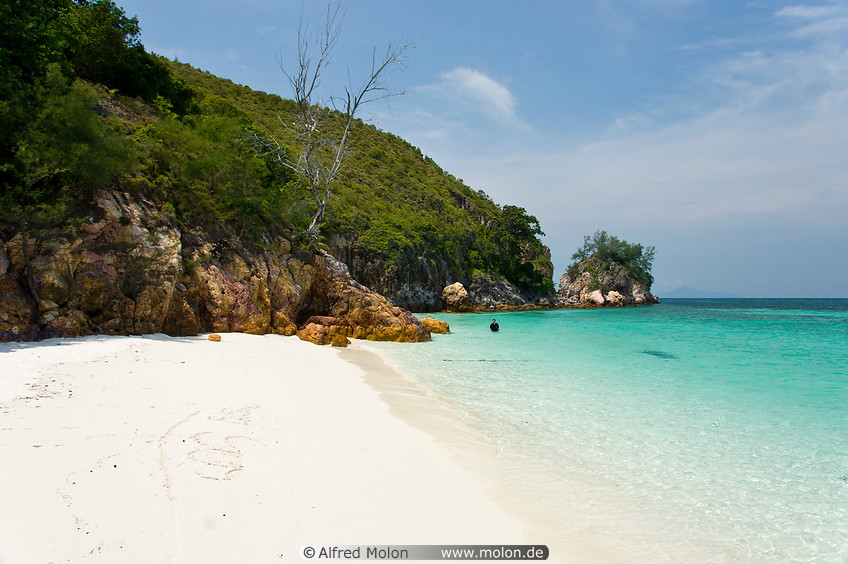 13 White coral sand beach with coconut trees