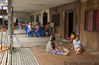 08 Villagers resting on the veranda