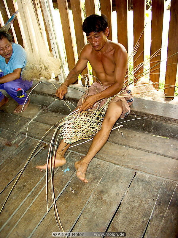 34 Kajang man weaving basket