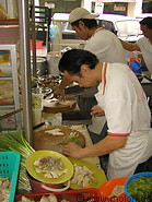 01 Cooks preparing chicken rice