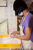 02 Woman preparing peanuts sweets