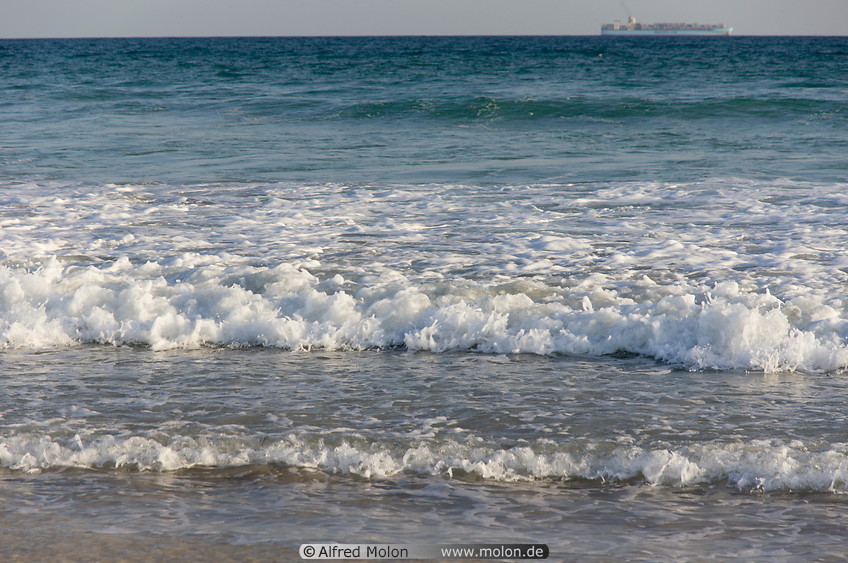 31 Waves breaking on sandy beach