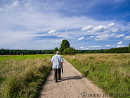 39 Tourist guide walking towards Bialowieza forest