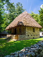 12 Stone house with reed roof