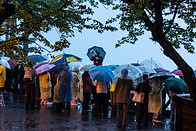 17 Tourists waiting for the sunrise in the rain