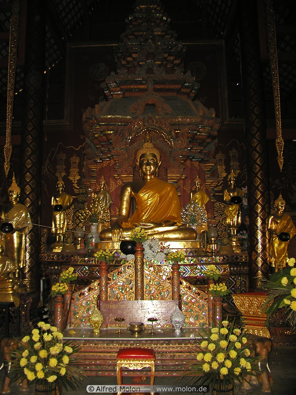 13 Buddha statue and yellow flowers