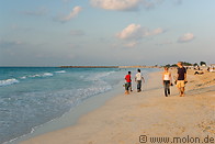 08 Tourists walking along Jumeirah beach at sunset