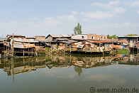 19 Corrugated metal huts on canal near Saigon